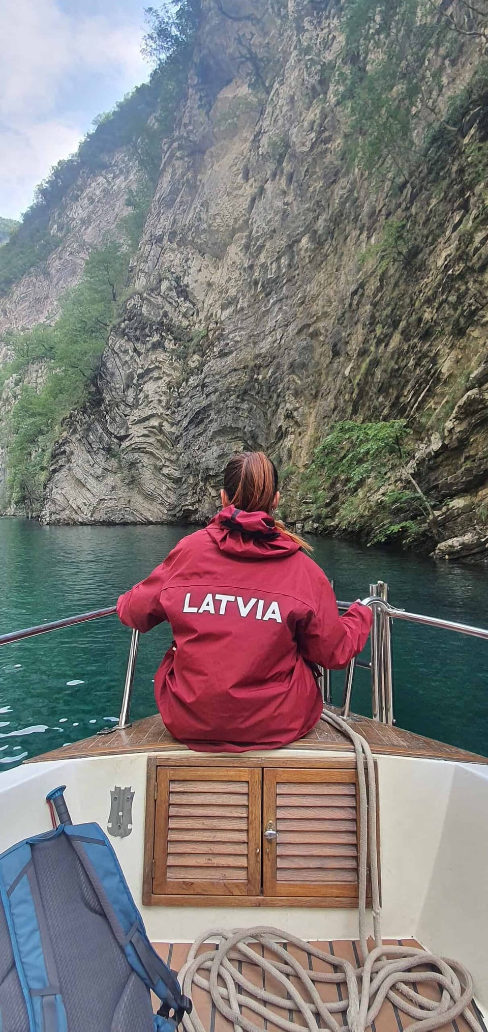 Boat between the cliffs of Komani Lake, on the Komani Lake & Shala River Day Trip